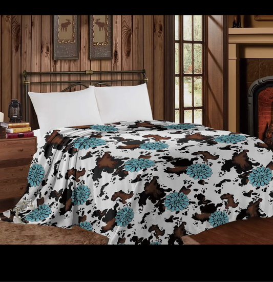 Turquoise cow print throw blanket