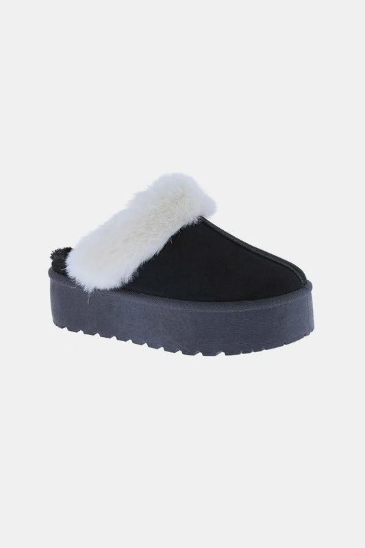 Cozy fuzzy lined slip on slippers in  black